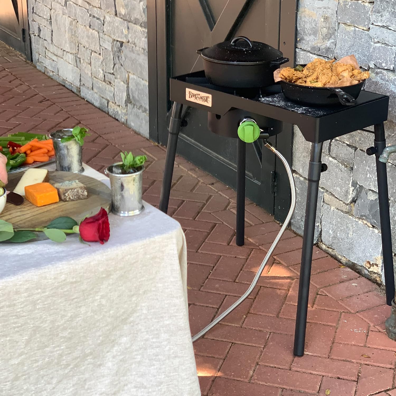 Bayou Classic Dual Patio Camp Stove w/Single Griddle Features Dual 6-in Cast Aluminum Burners 27-in Tall Cooker 13.5-in x 13.5-in Square Removable Griddle Perfect For Backyard Chefs Tailgates