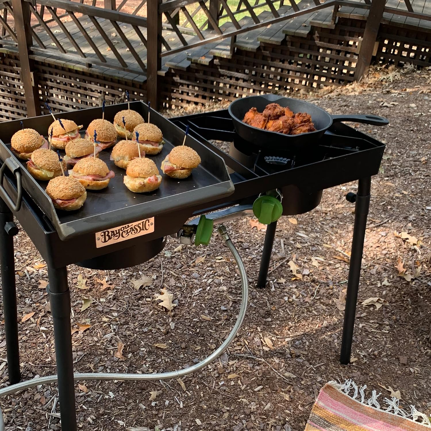 Bayou Classic Dual Patio Camp Stove w/Single Griddle Features Dual 6-in Cast Aluminum Burners 27-in Tall Cooker 13.5-in x 13.5-in Square Removable Griddle Perfect For Backyard Chefs Tailgates