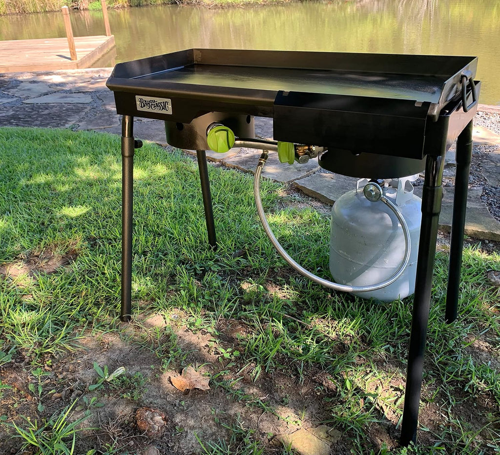 Bayou Classic Dual Patio Camp Stove w/Double Griddle Features Dual 6-in Cast Aluminum Burners 27-in Tall Cooker 13.5-in x 13.5-in Square Removable Griddle Perfect For Backyard Chefs Tailgates