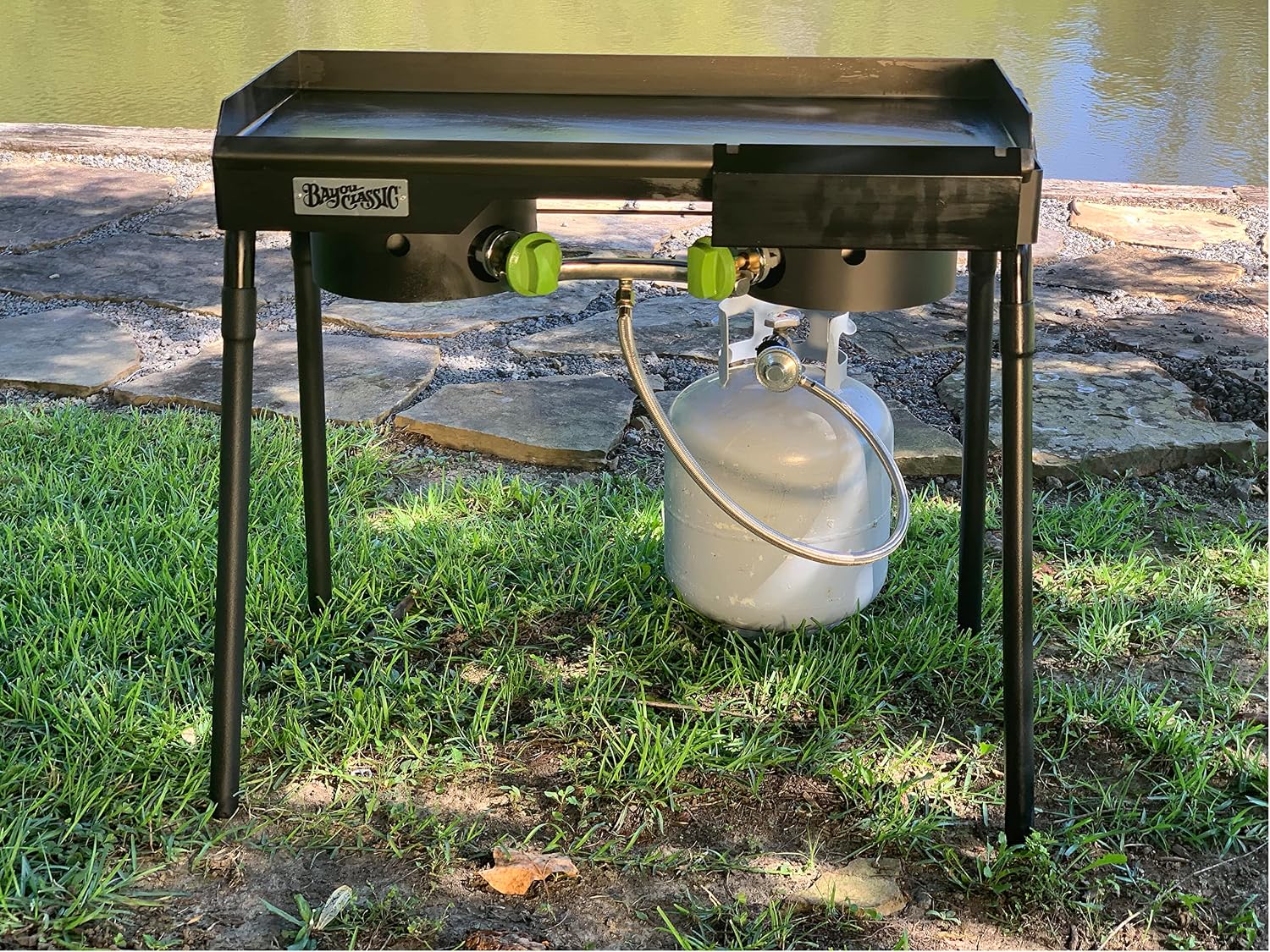 Bayou Classic Dual Patio Camp Stove w/Double Griddle Features Dual 6-in Cast Aluminum Burners 27-in Tall Cooker 13.5-in x 13.5-in Square Removable Griddle Perfect For Backyard Chefs Tailgates